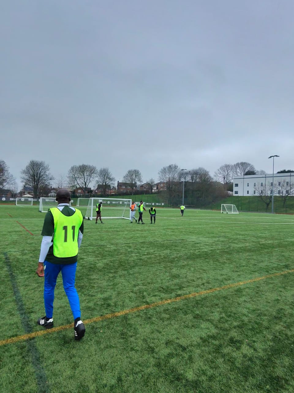 Men taking part in Seniorman football activity